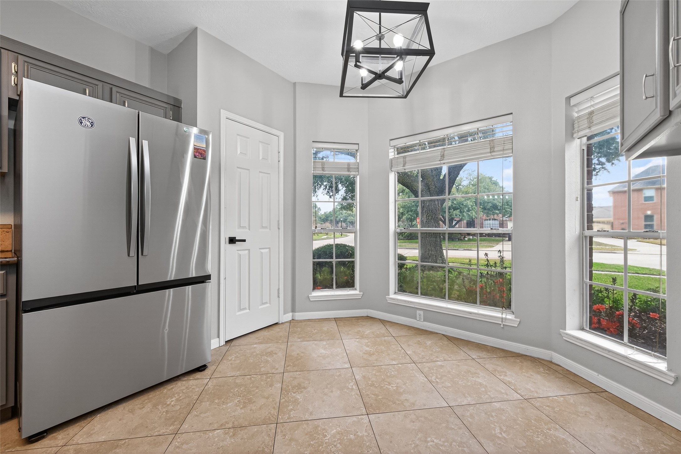 16902 Canyon Ridge Drive Spring, TX 77379 - Photo 17 of 43 a view of a refrigerator in kitchen and windows