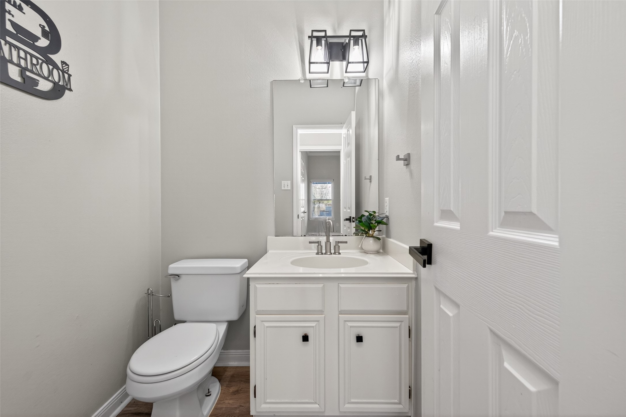 16902 Canyon Ridge Drive Spring, TX 77379 - Photo 19 of 43 a bathroom with a sink a toilet and mirror