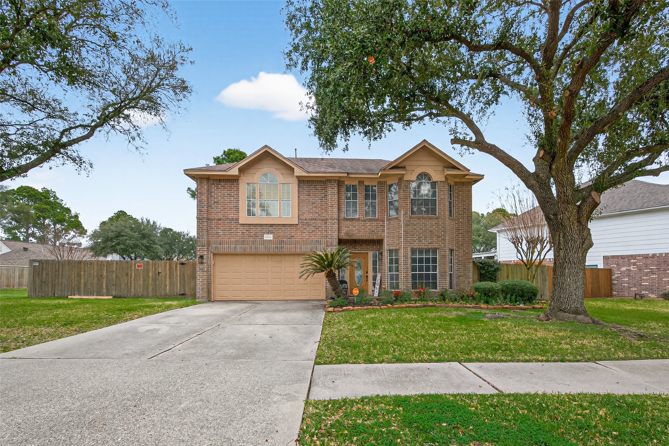 16902 Canyon Ridge Drive Spring, TX 77379 - Photo 2 of 43 a front view of a house with a yard and garage