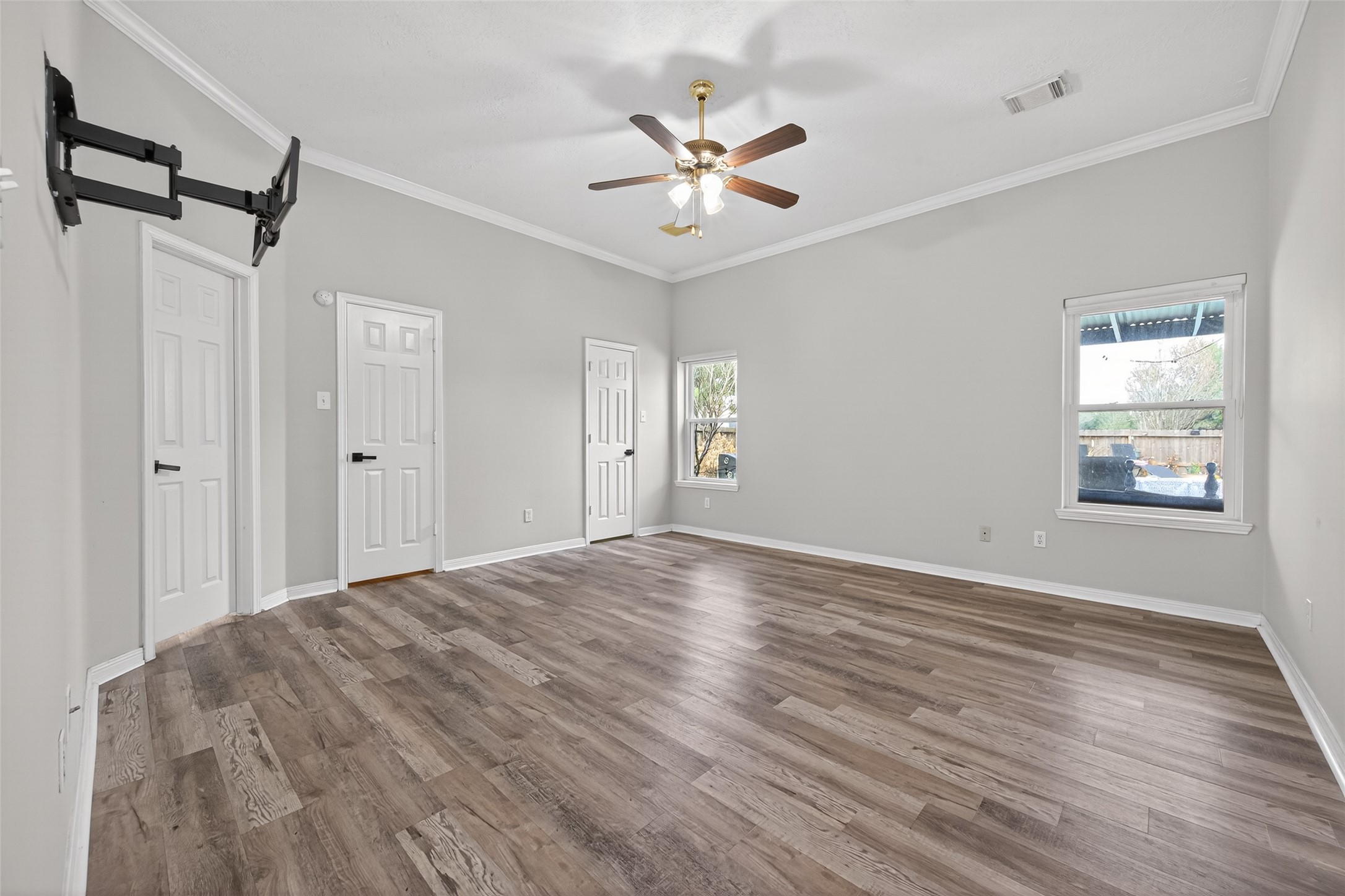 16902 Canyon Ridge Drive Spring, TX 77379 - Photo 21 of 43 a view of a livingroom with a ceiling fan window and wooden floor