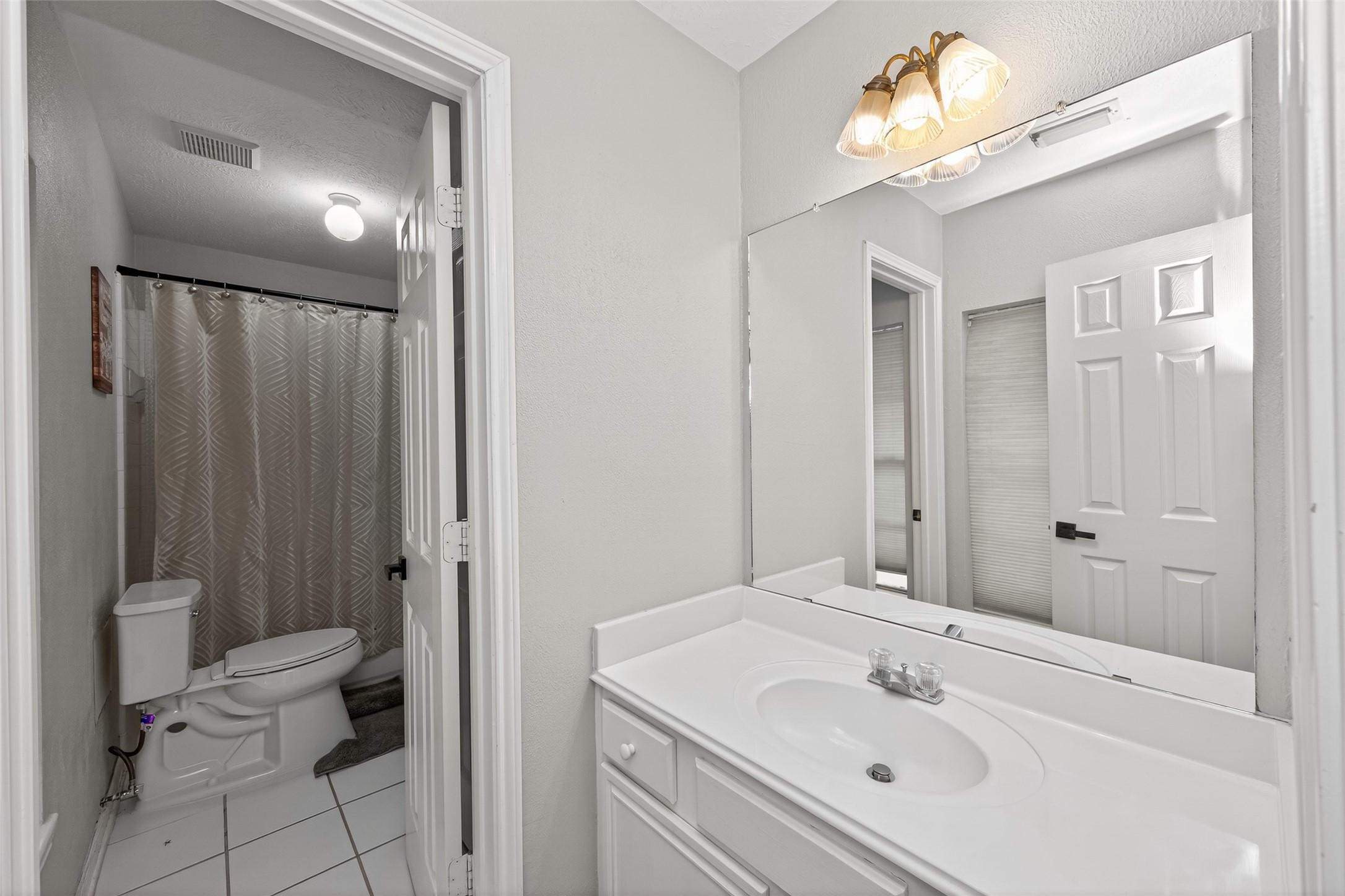 16902 Canyon Ridge Drive Spring, TX 77379 - Photo 31 of 43 a bathroom with a sink a toilet and shower