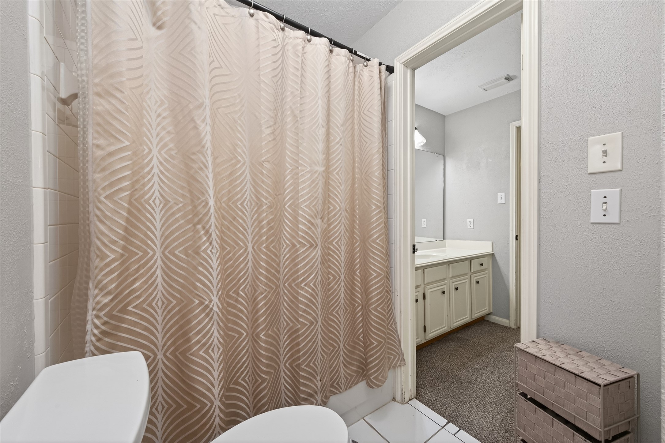 16902 Canyon Ridge Drive Spring, TX 77379 - Photo 32 of 43 a bathroom with a granite countertop sink mirror vanity and toilet
