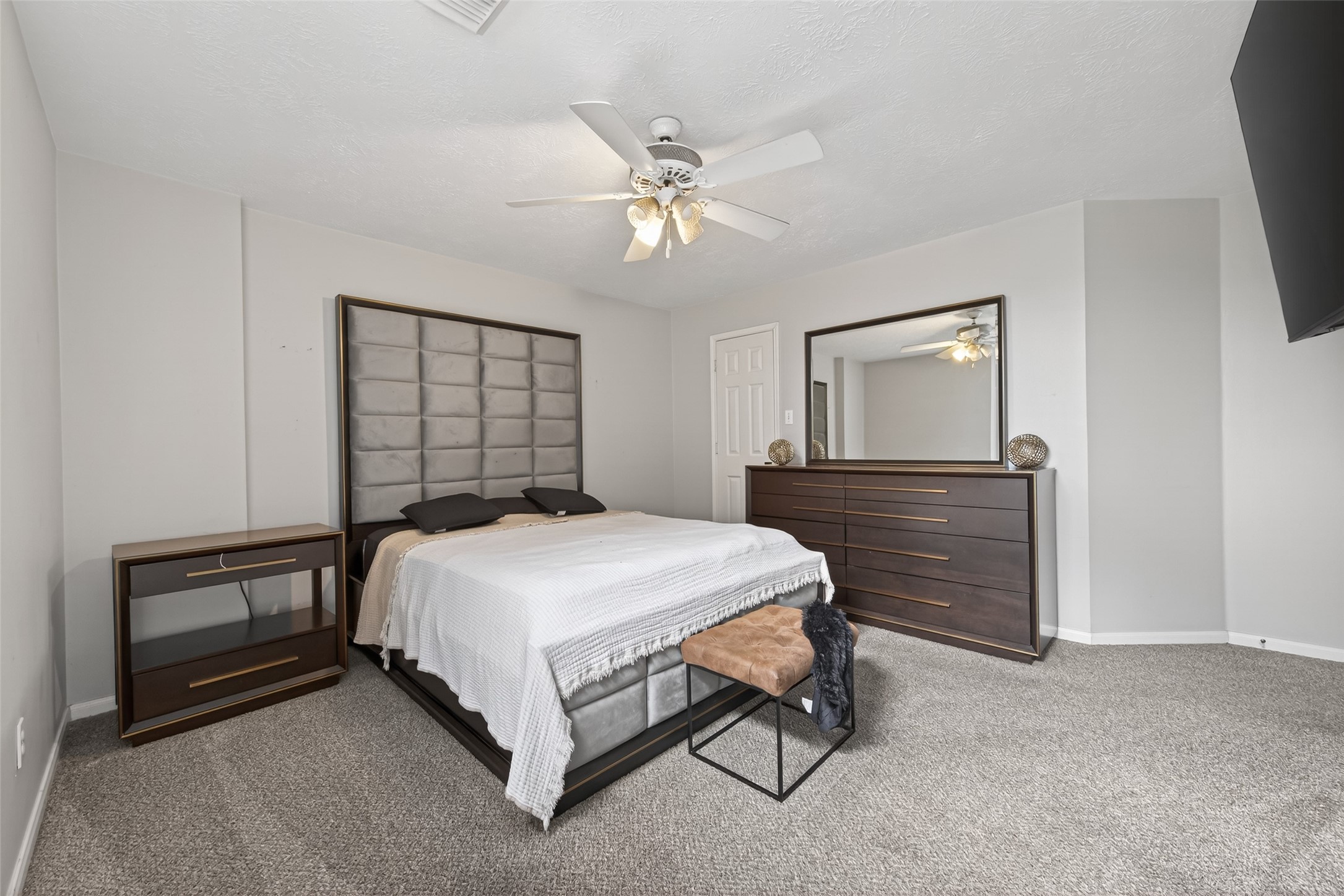 16902 Canyon Ridge Drive Spring, TX 77379 - Photo 35 of 43 a bedroom with a bed and a chandelier