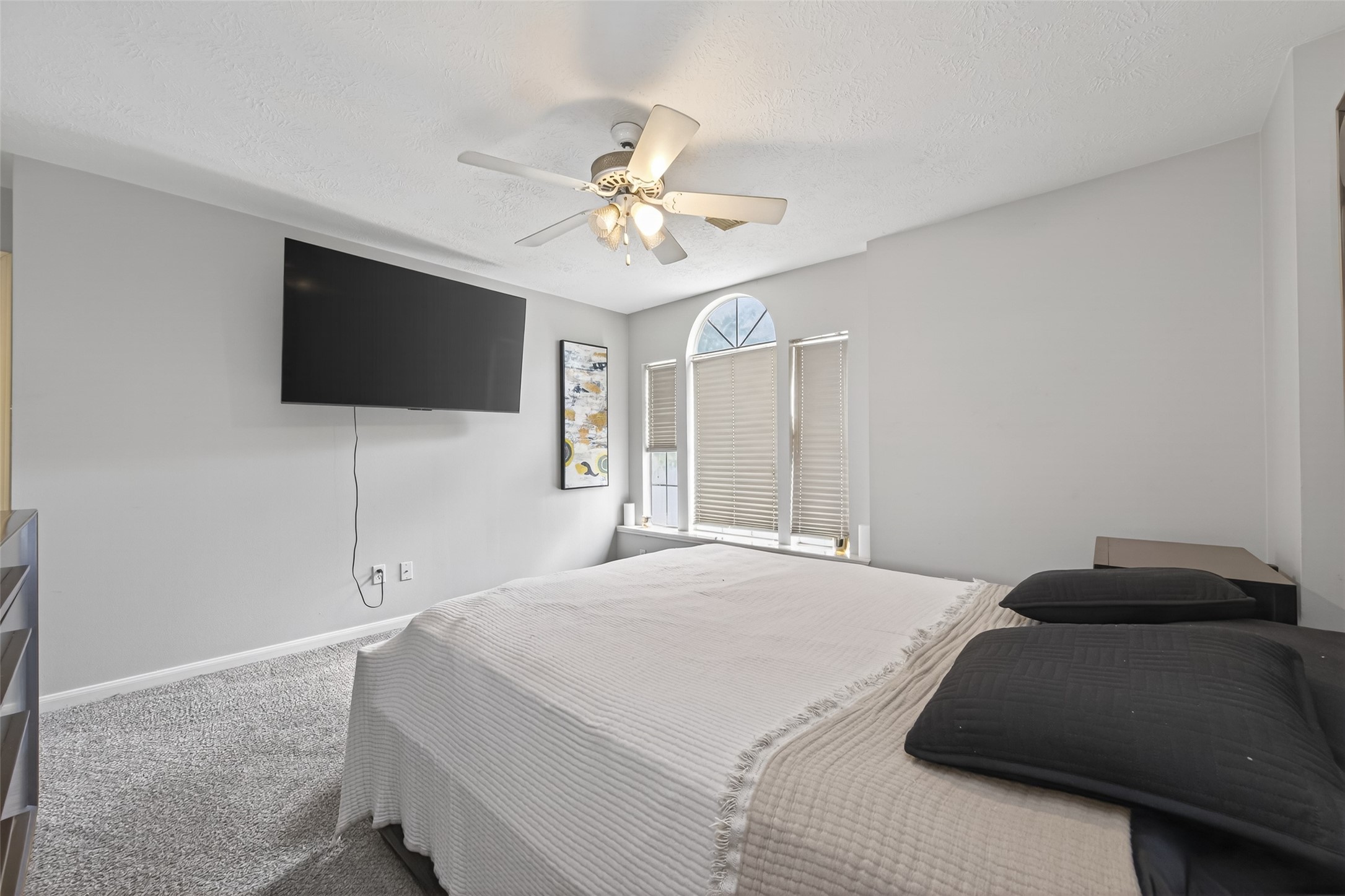 16902 Canyon Ridge Drive Spring, TX 77379 - Photo 36 of 43 a bedroom with a bed and a flat screen tv