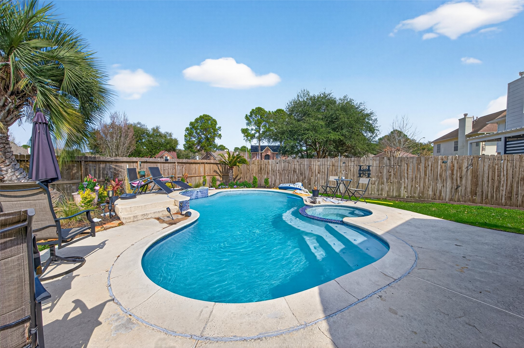 16902 Canyon Ridge Drive Spring, TX 77379 - Photo 42 of 43 a view of a swimming pool with a patio