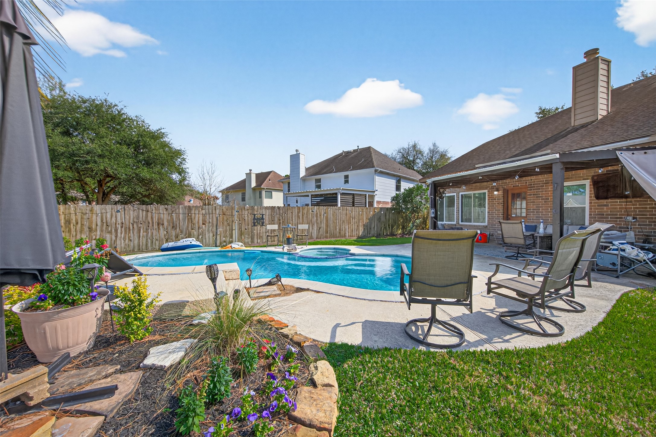 16902 Canyon Ridge Drive Spring, TX 77379 - Photo 43 of 43 a swimming pool with outdoor seating and yard