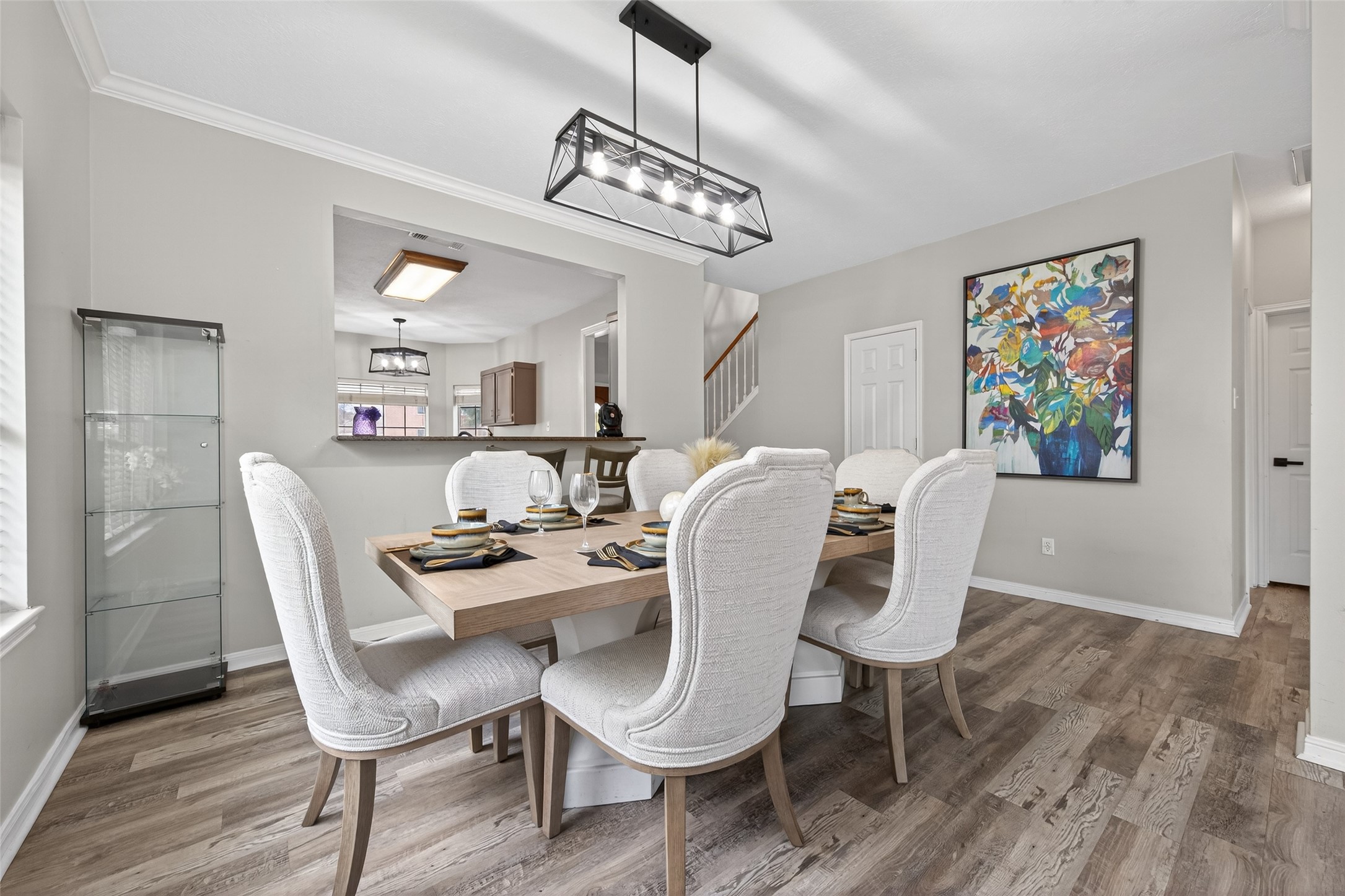 16902 Canyon Ridge Drive Spring, TX 77379 - Photo 5 of 43 a view of a dining room with furniture wooden floor and a chandelier
