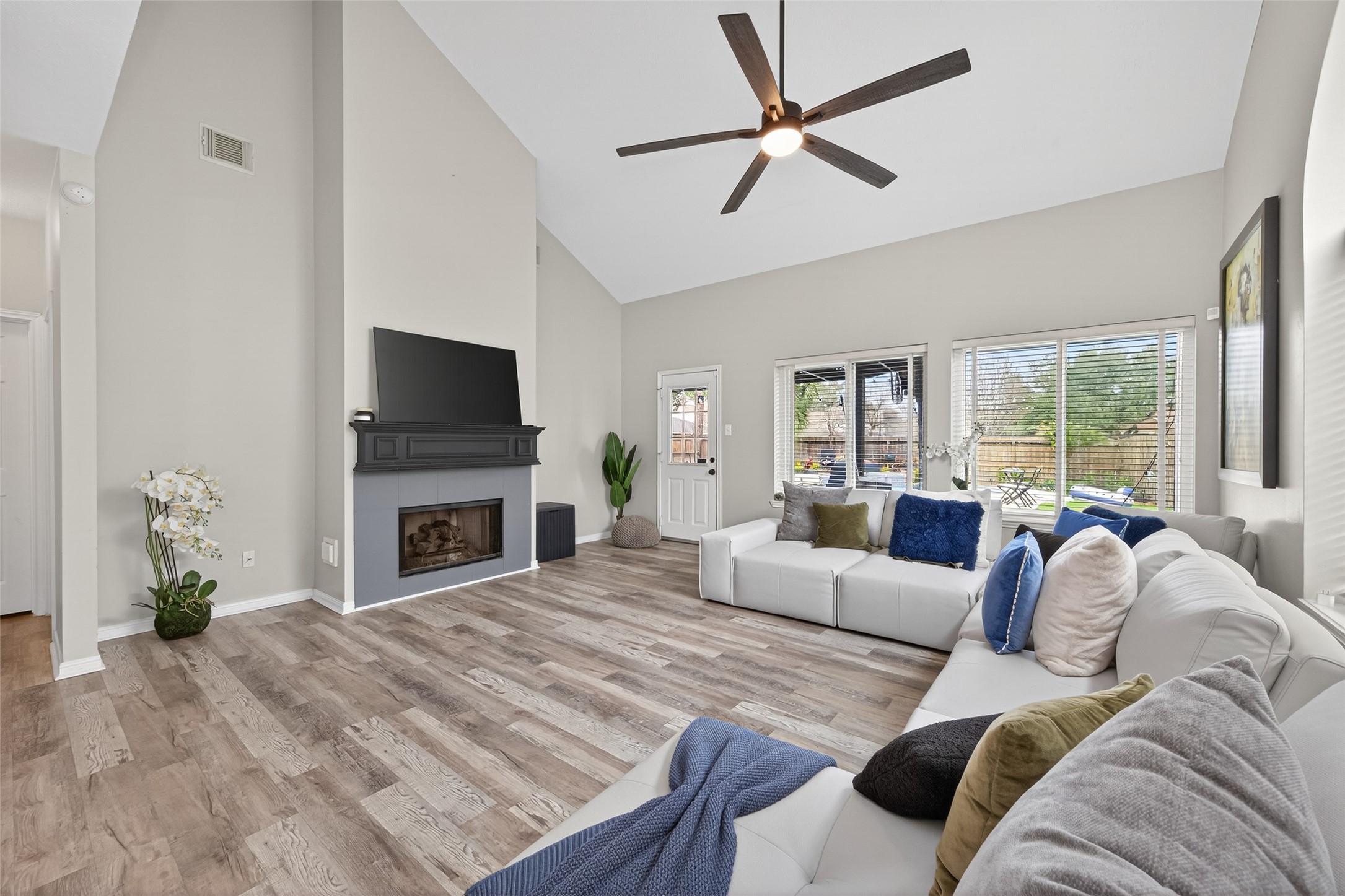 16902 Canyon Ridge Drive Spring, TX 77379 - Photo 8 of 43 a living room with furniture a fireplace and a flat screen tv