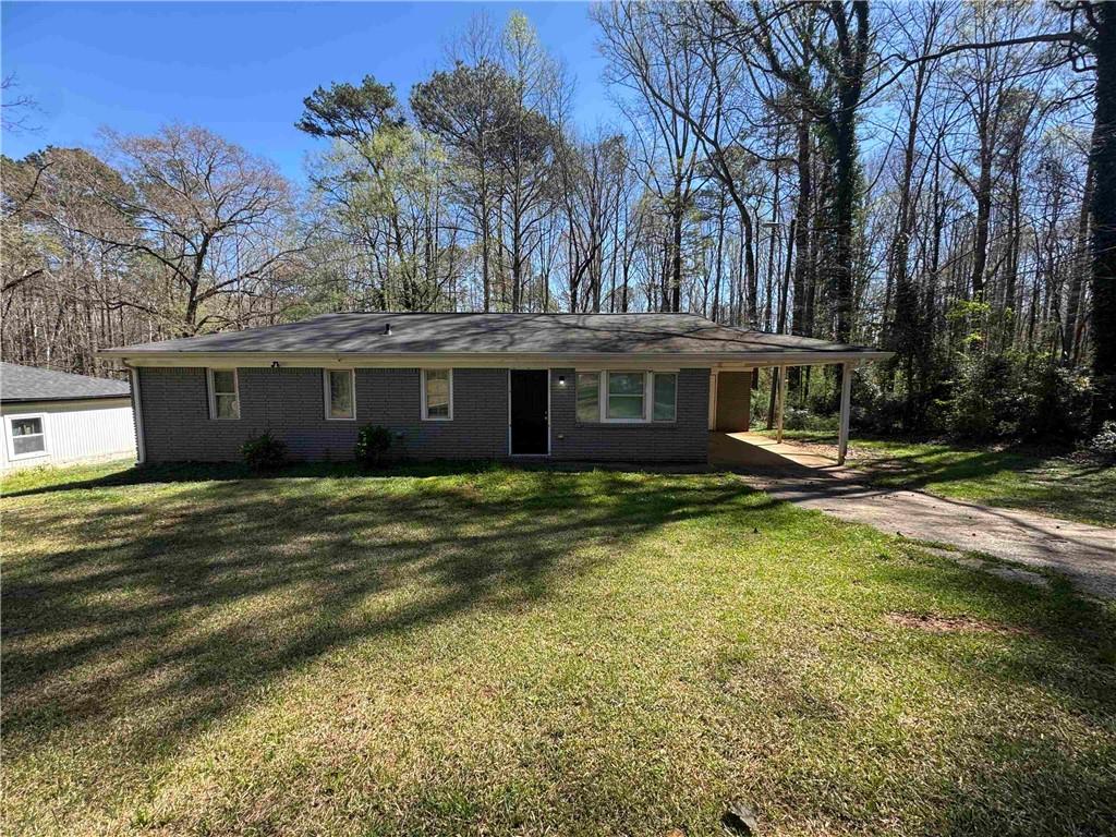 2536 Butner Road Atlanta, GA 30331 - Photo 2 of 19 a front view of a house with swimming pool having outdoor seating