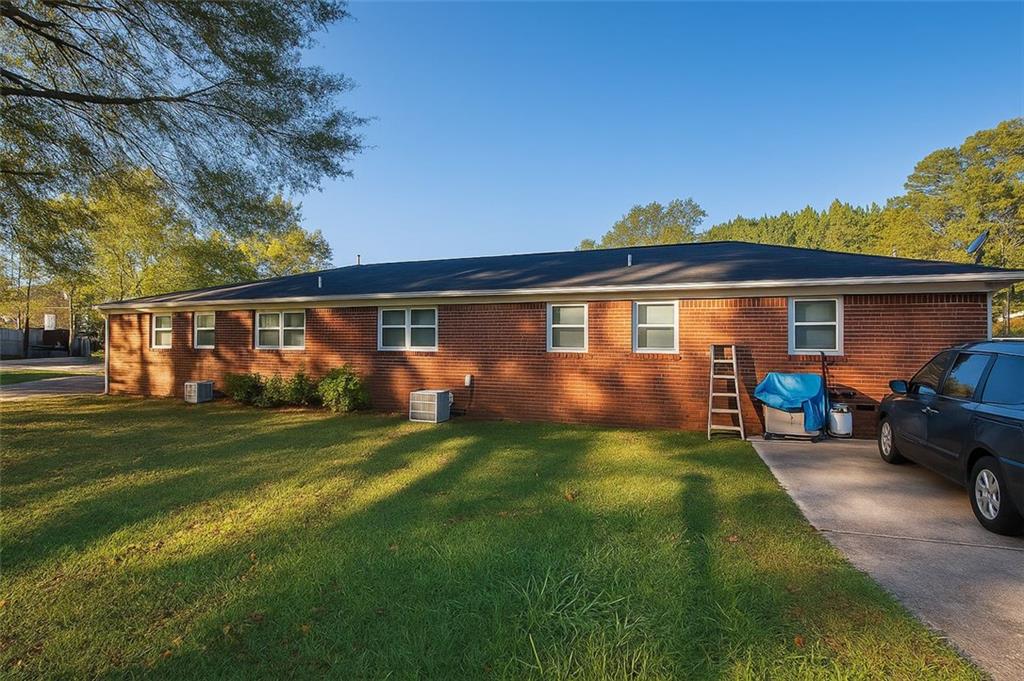 4500 Cemetery Street Powder Springs, GA 30127 - Photo 4 of 6 a view of a house with a back yard