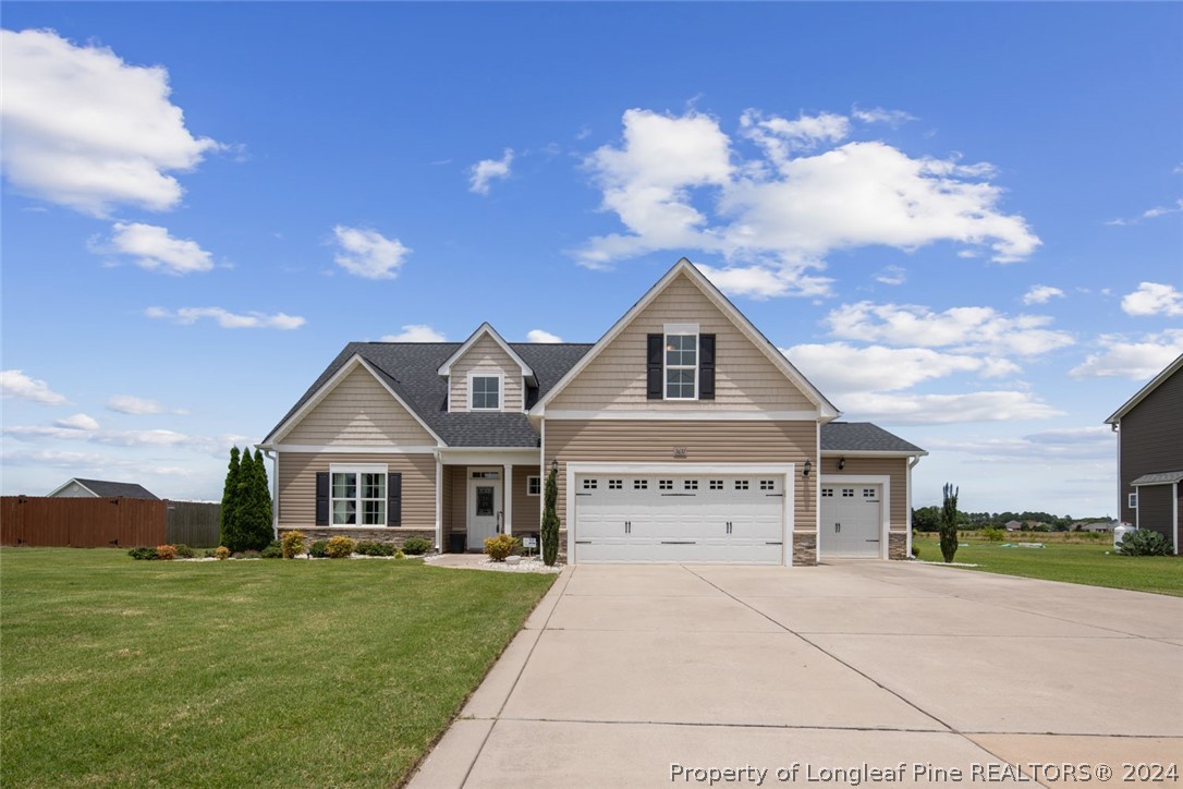 3631 Thrower Road Hope Mills, NC 28348 - Photo 1 of 50 a front view of a house with garden