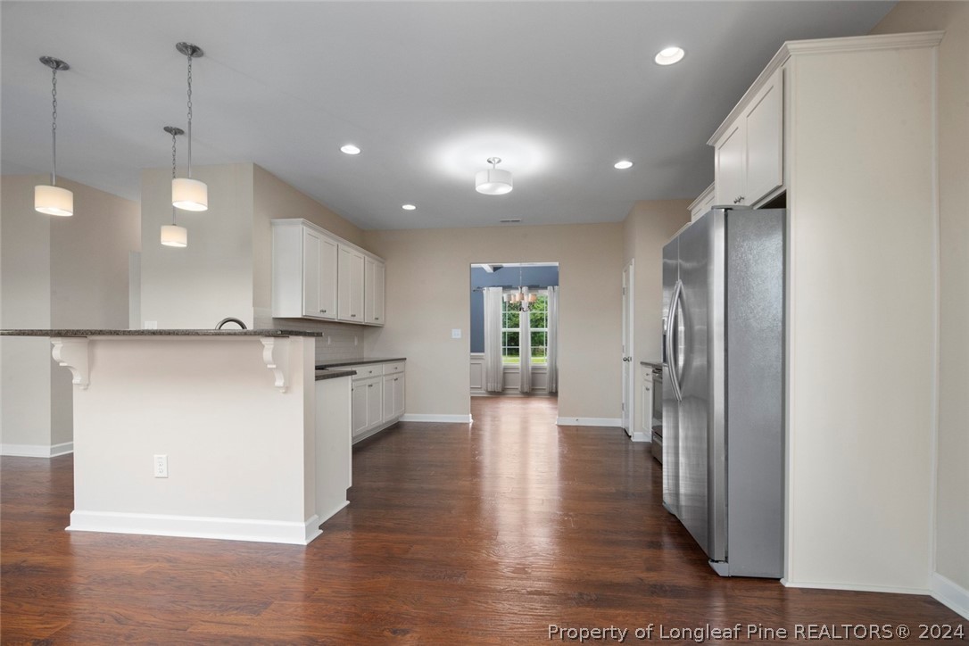 3631 Thrower Road Hope Mills, NC 28348 - Photo 18 of 50 a view of a kitchen with a refrigerator and a stove