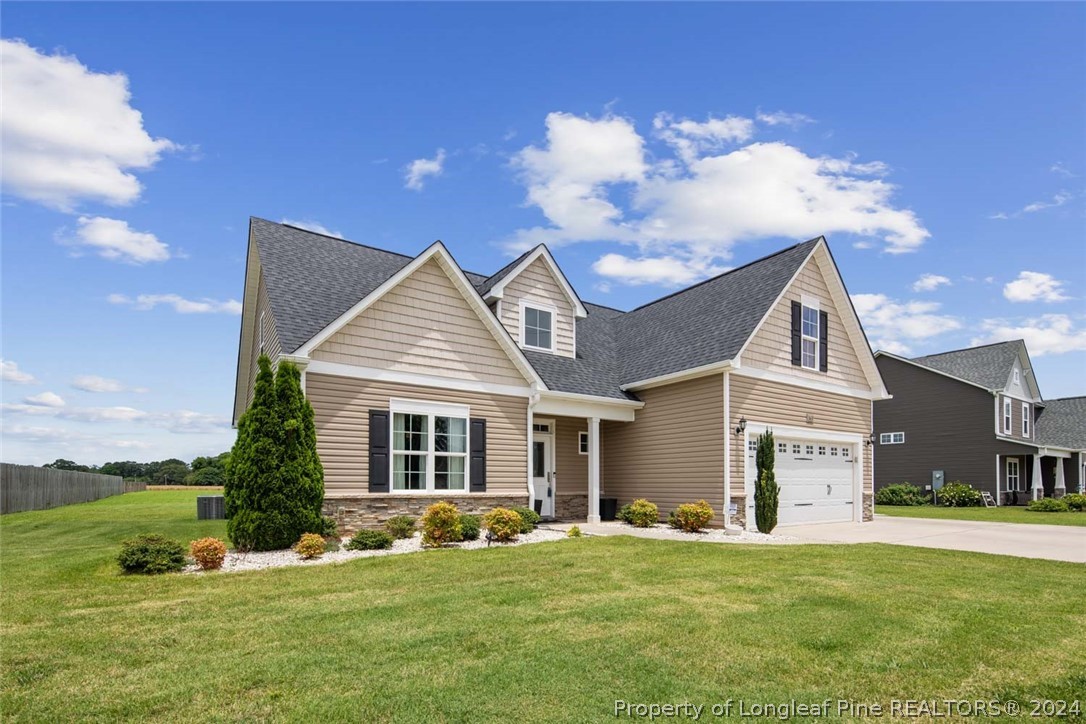 3631 Thrower Road Hope Mills, NC 28348 - Photo 2 of 50 a view of a house with a yard
