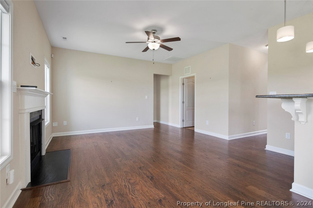 3631 Thrower Road Hope Mills, NC 28348 - Photo 22 of 50 a view of an empty room with wooden floor and a ceiling fan