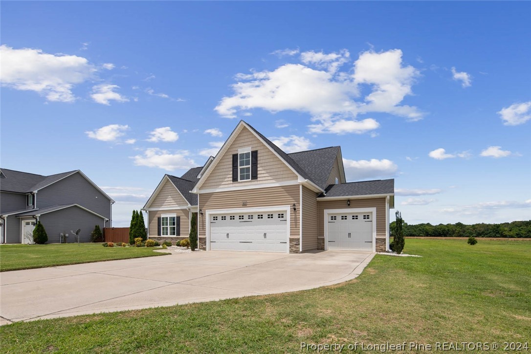 3631 Thrower Road Hope Mills, NC 28348 - Photo 3 of 50 a front view of a house with garden