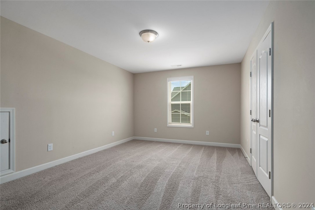 3631 Thrower Road Hope Mills, NC 28348 - Photo 39 of 50 a view of room with window and hardwood floor