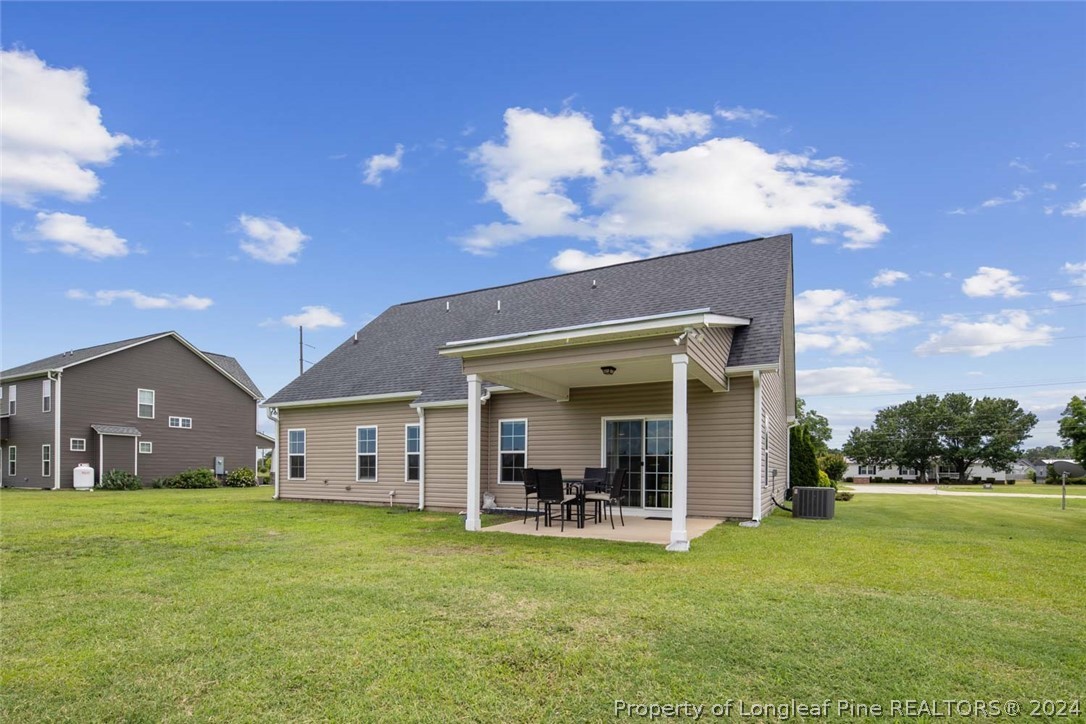 3631 Thrower Road Hope Mills, NC 28348 - Photo 50 of 50 a view of a house with a swimming pool and a yard