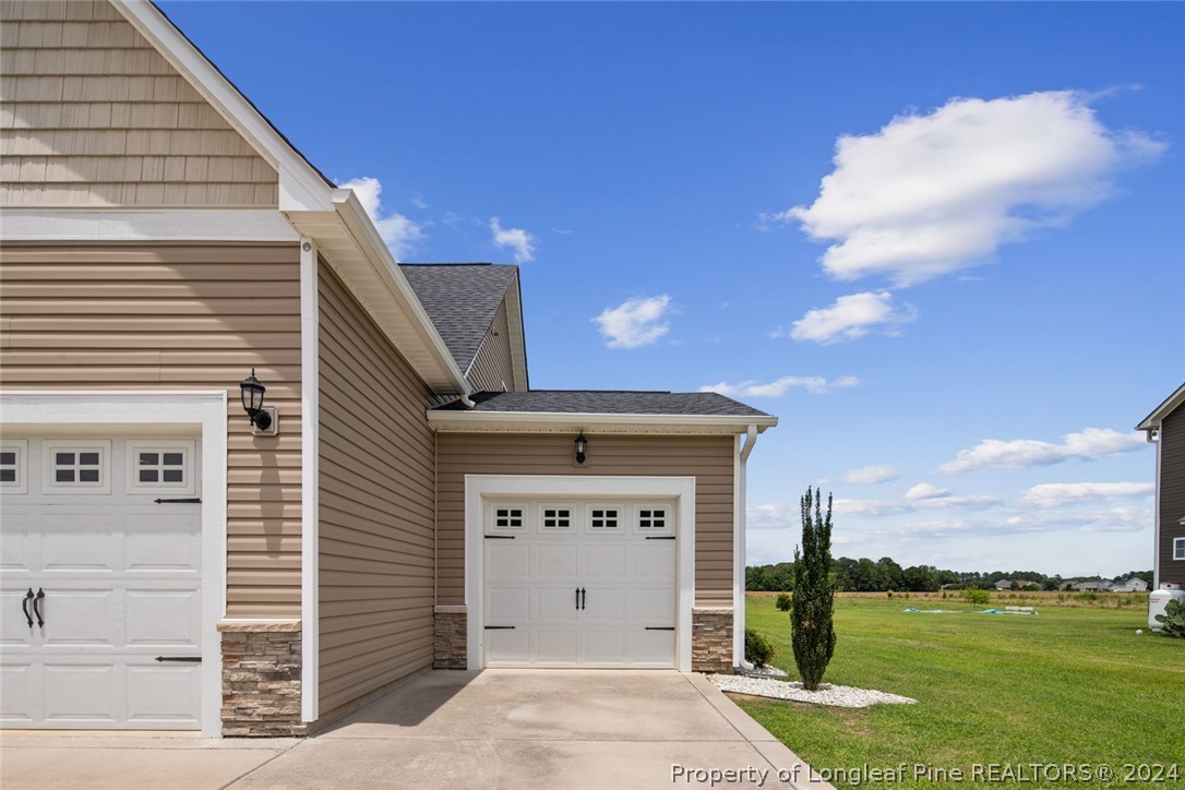 3631 Thrower Road Hope Mills, NC 28348 - Photo 6 of 50 a view of a house with a yard