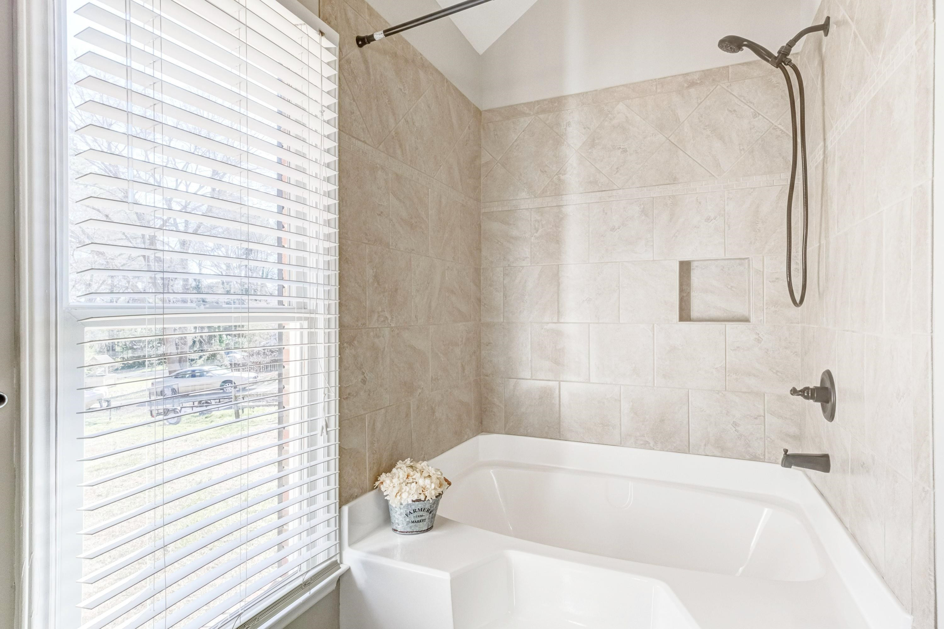 9305 Tallgrass Road Raleigh, NC 27603 - Photo 22 of 49 Reglazed tub with step up garden tub with tiled surround! Owners Bathroom