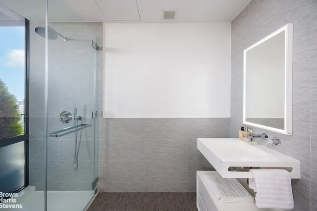 a bathroom with a sink and shower