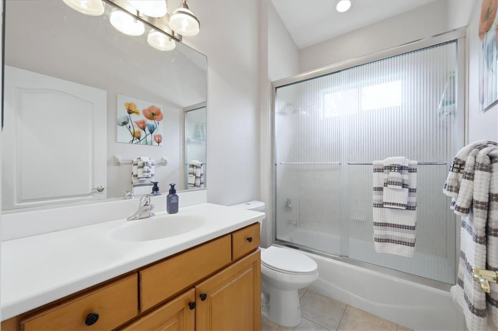 428 Snapdragon Loop Bradenton, FL 34212 - Photo 23 of 33 a bathroom with a sink a toilet and shower