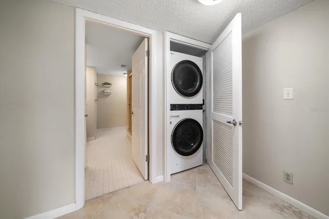 a view of a hallway with washer and dryer