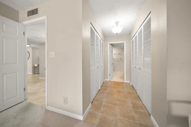a bathroom with a granite countertop sink mirror and double