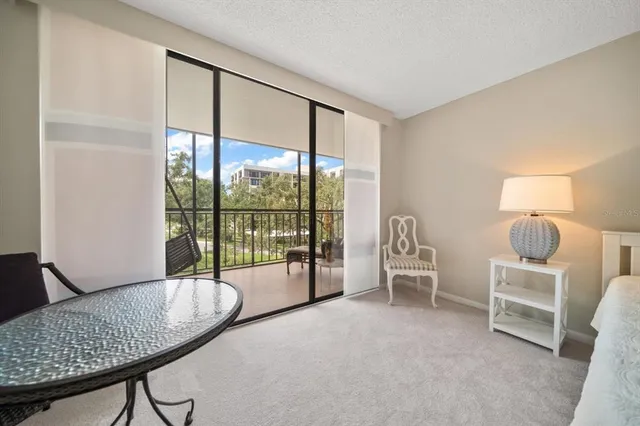 a balcony with furniture and view of lake