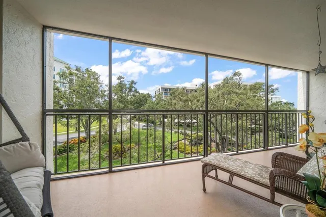 a view of a garden with a building in the background