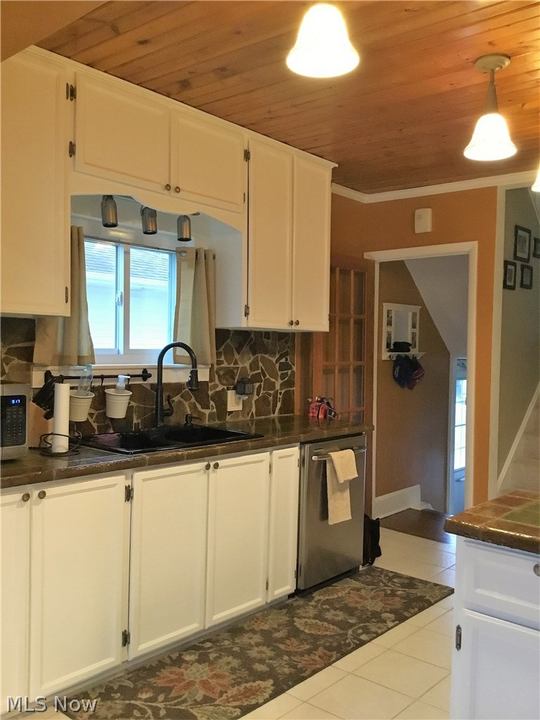 1359 Irene Road Lyndhurst, OH 44124 - Photo 12 of 32 Take notice of the details. One of a kind cement stamped counter tops and wood planked ceilings.