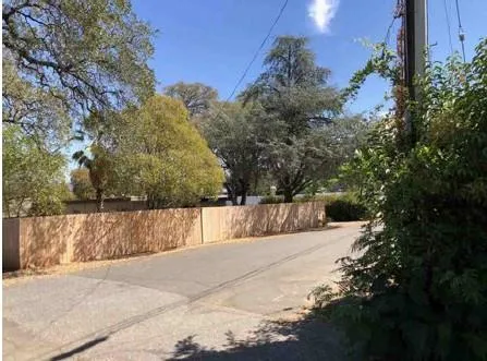 a view of staircase with white walls and a window