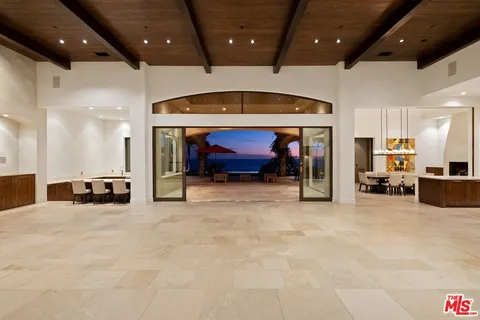 a kitchen with a stove a sink and a refrigerator