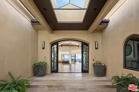 a view of swimming pool is middle in the garden