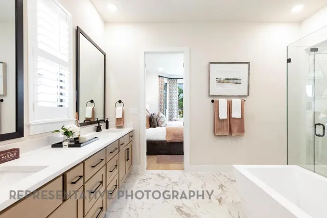 a spacious bathroom with sinks mirror and a shower