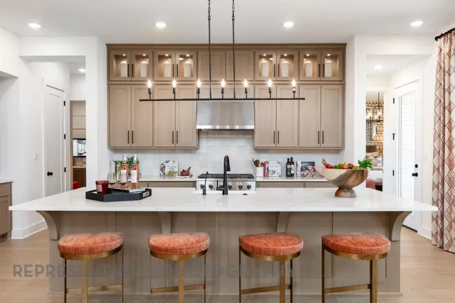 a kitchen with stainless steel appliances granite countertop a sink and cabinets