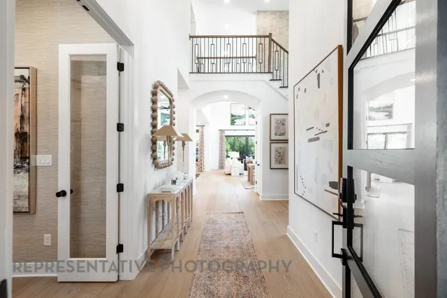 a view of an entryway with wooden floor