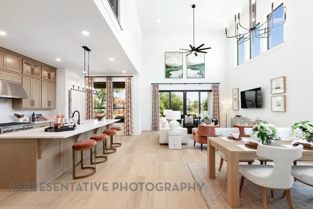 a living room with furniture wooden floor and a chandelier