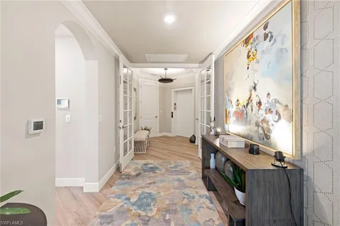 a bathroom with a large mirror a sink and shower