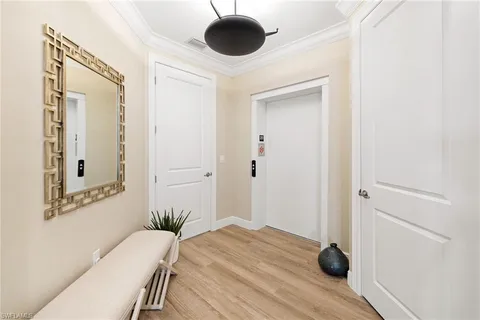 a view of a livingroom with wooden floor and closet