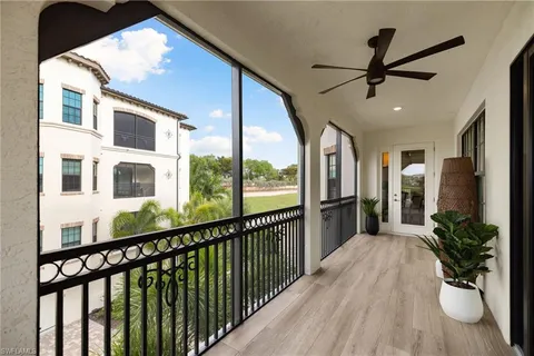 a view of a porch with wooden floor and fence