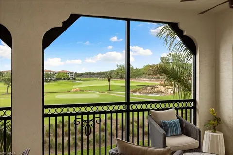 a view of balcony with furniture and floor to ceiling window