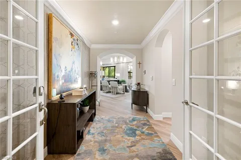 a view of a kitchen with dining room and windows