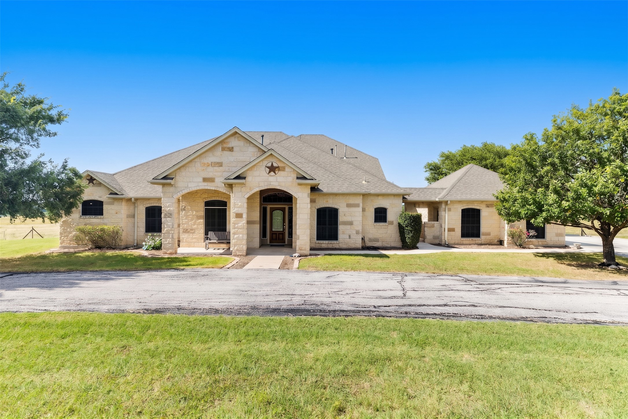 20145 Janak Road Coupland, TX 78615 - Photo 1 of 40 Escape to the beauty of Central Texas with this exceptional custom home set on 78.5 rolling acres surrounded by scenic countryside.