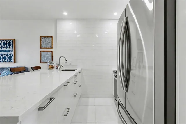 a bathroom with a double vanity sink a mirror and a shower