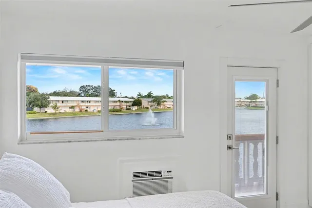 a room with a bed and a window