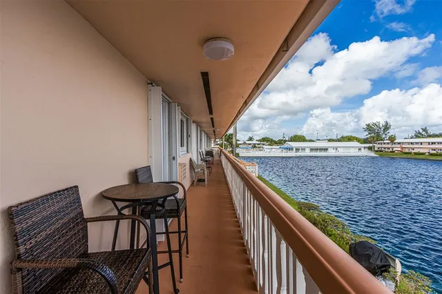 a view of balcony with furniture