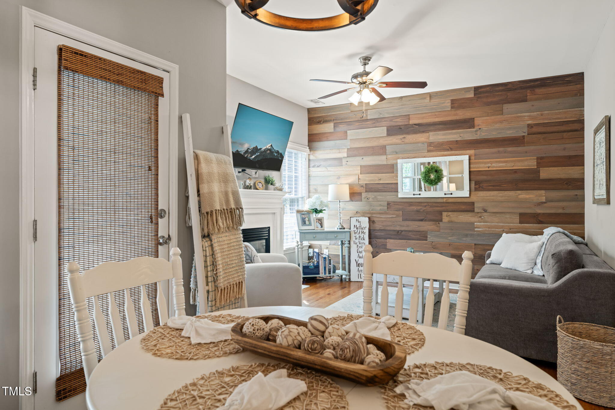 8221 Hempshire Place, Unit 101 Raleigh, NC 27613 - Photo 5 of 24 a living room with furniture and a chandelier
