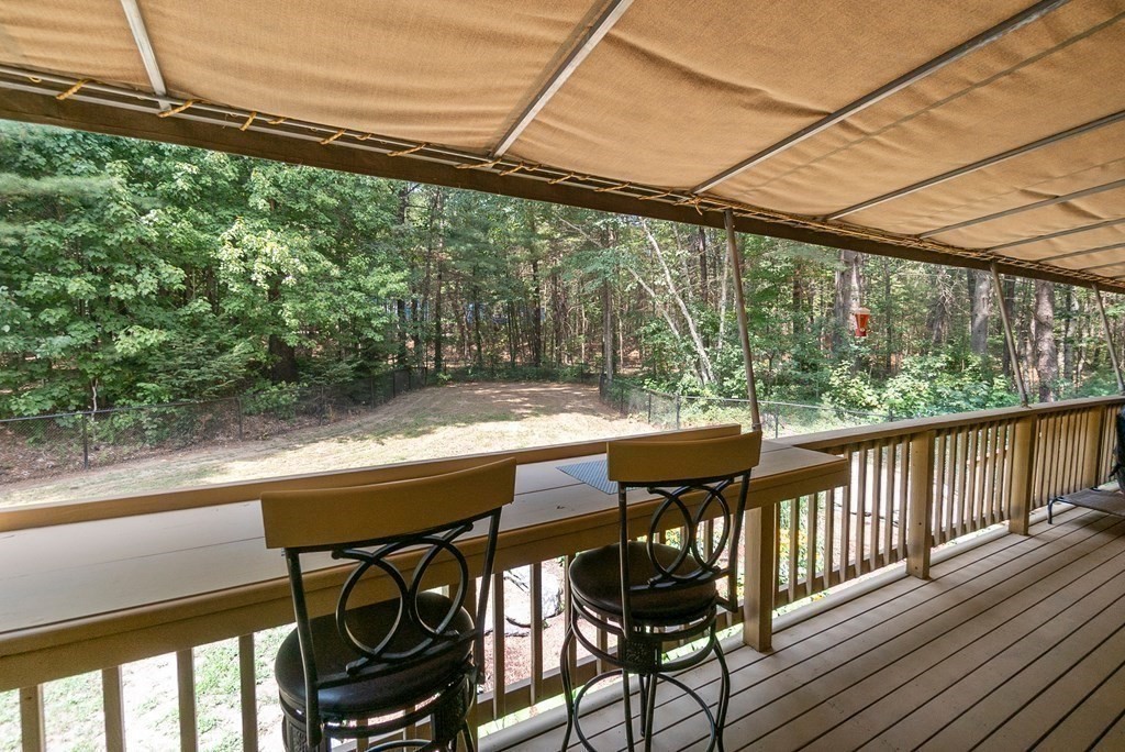 96 Old Mill Road Harvard, MA 01451 - Photo 16 of 32 a view of balcony with furniture and wooden bench