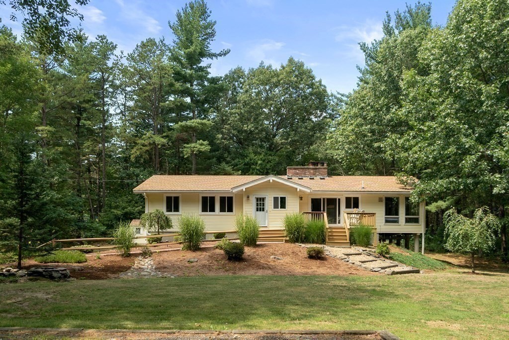 96 Old Mill Road Harvard, MA 01451 - Photo 24 of 32 a view of a house with swimming pool and sitting area