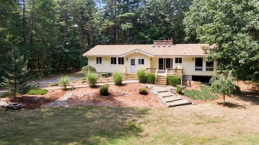 96 Old Mill Road Harvard, MA 01451 - Photo 29 of 32 a view of a house with backyard and sitting area